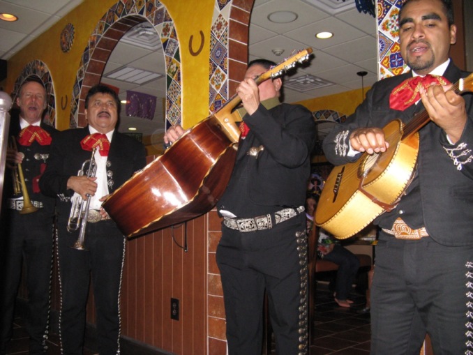 Members of Mariachi Estamwa de America serenading diners