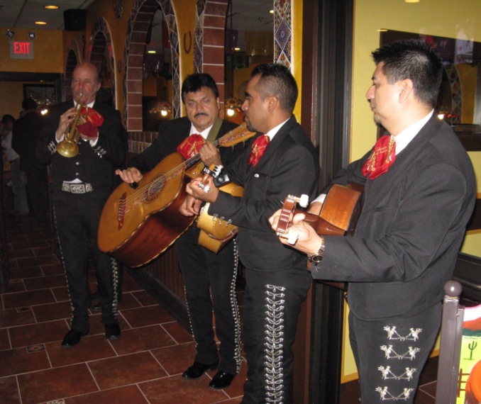 Members of Mariachi Estamwa de America serenading diners